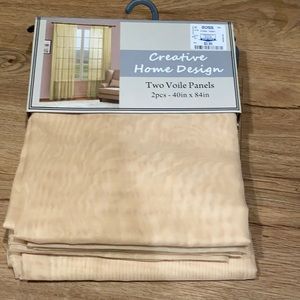 Yellow sheer panel curtains. Total of 4 panels